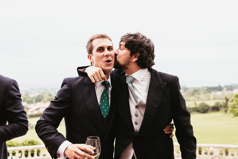 gay wedding grooms kissing