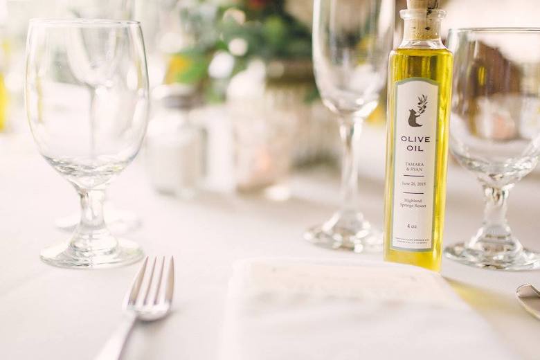 olive oil on table as wedding favors
