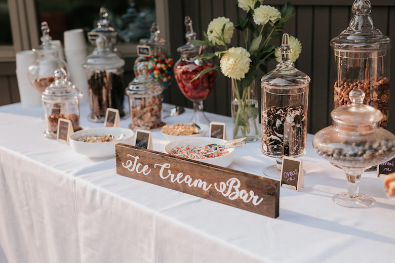 ice cream bar with toppings on table